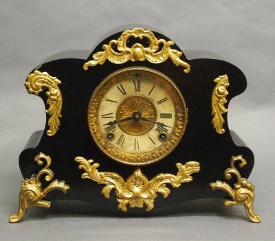 Ansonia mantle clock: A turn of the century Ansonia "Amiens" model Iron mantle clock. 8-day time and strike movement. Some wear, repainted. 10" high overall. ESTIMATE $100-150
