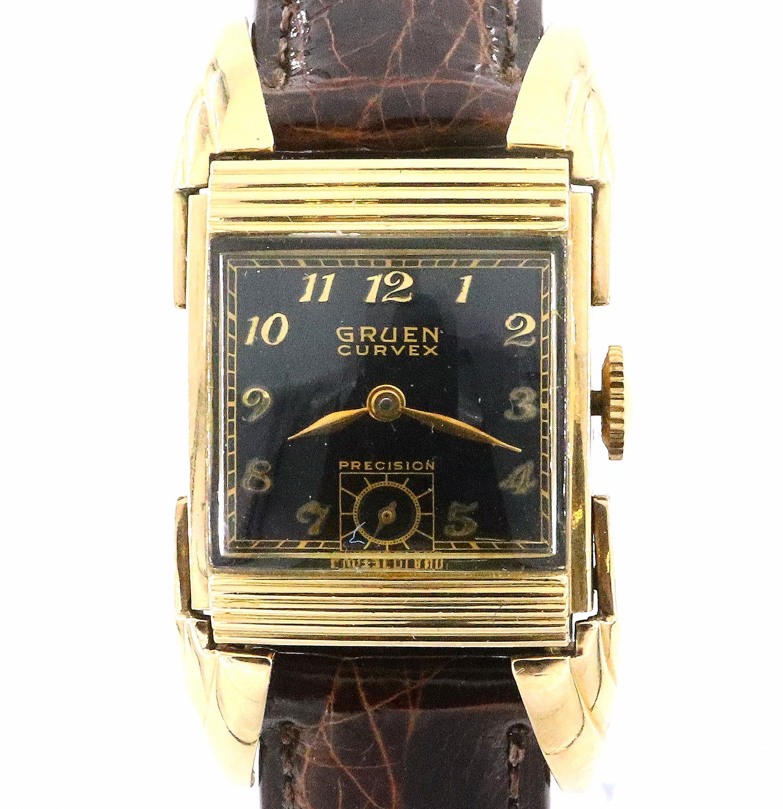 Art Deco Gruen Curvex Drivers Wristwatch: A 1920's Art Deco Gruen "Curvex, Precision" model Driver's wristwatch with fancy Bat Wing lugs. 17 j, manual wind with Black dial, Arabic numerals and subsidiary seconds. 22 x 25 mm 10k Gold Filled ca