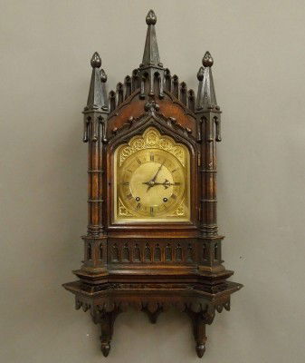 Gothic Bracket clock: A late 19th century Gothic Revival Oak Bracket clock by Winterhalder & Hoffmeier. Hand carved Oak Cathedral form case with the original matching shelf with the original Dark finish. 8-day time and str
