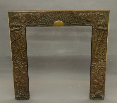 Art Deco fire surround: A 20th century Art Deco fire surround. Cast Iron with a rising Sun, Torches and Smoke design in the original Copper patinated finish. Minor wear. 30 1/2 x 30 1/2" overall. ESTIMATE $400-600