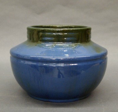Fulper Pottery vase: A 20th century Fulper Art Pottery vase. Molded bulbous design with sloped shoulder and geometric neck detail in a Blue/Green Crystalline glaze. Stamped vertical "Fulper" mark. Slight surface wear. 6 1