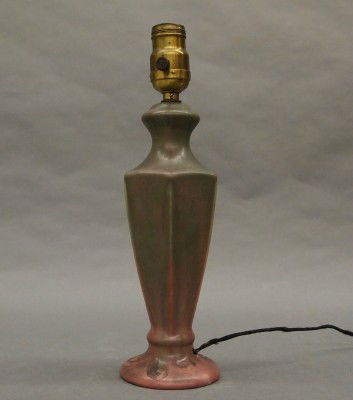 Fulper Pottery lamp: A 20th century Fulper Art Pottery lamp. Baluster form with paneled stem in a Matte Pink/Purple glaze. Unmarked. Slight wear. 13" high overall. ESTIMATE $100-200