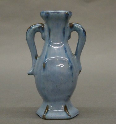 Fulper Pottery vase: A 20th century Fulper Art Pottery vase. Molded design with two handles in a Blue speckled Flambe glaze. Stamped vertical "Fulper" mark. Slight surface wear. 6" high. ESTIMATE $50-100