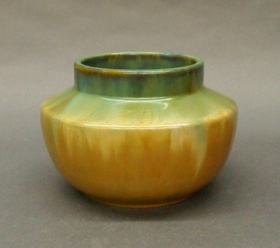 Fulper Prang Art Pottery vase: A 20th century Fulper Prang Art Pottery vase. Shouldered bulbous design with a Green/Tan Flambe glaze. Stamped vertical "Prang" mark. Slight surface wear, minor glaze imperfections. 4 1/2" high. ESTIM