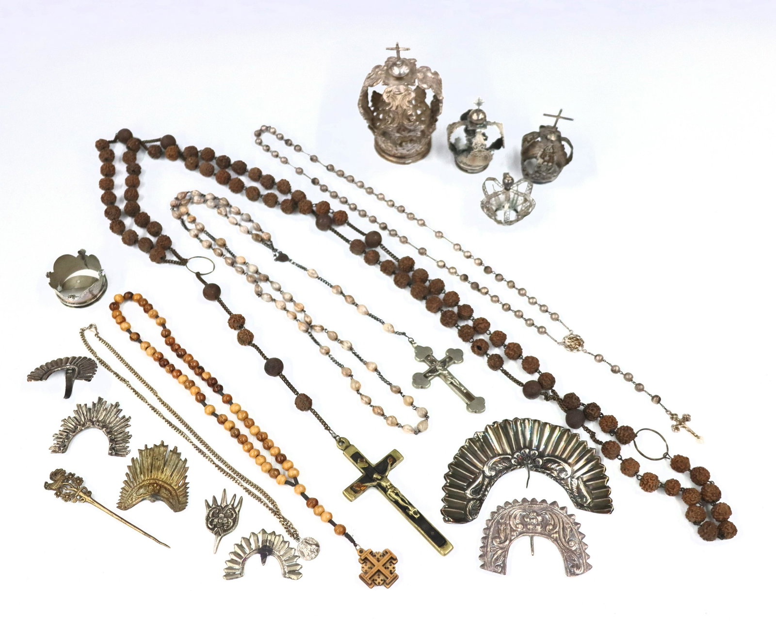 Collection of Catholic Accessories: A collection of Catholic items and Santos accessories. Includes approximately five rosaries, a Saint medallion, twelve cast metal Santos crowns, etc. Some wear and damage. ESTIMATE $50-75