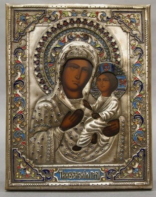 Russian Icon: A Russian Orthodox Icon with Madonna and Child. Hammered metal over wood with intricate Champleve inlay and painted image. Some wear. 7 1/2" high. ESTIMATE $300-500
