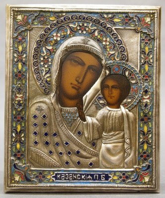 Russian Icon: A Russian Orthodox Icon with Madonna and Child. Hammered metal over wood with intricate Champleve inlay and painted image. Some wear. 6 1/2" high. ESTIMATE $200-400