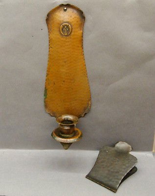 2 Arts & Crafts Copper items: An Arts & Crafts Period hammered Copper Gustav Stickley paper clip and a small unmarked candle sconce. Both with minor wear. ESTIMATE $100-150