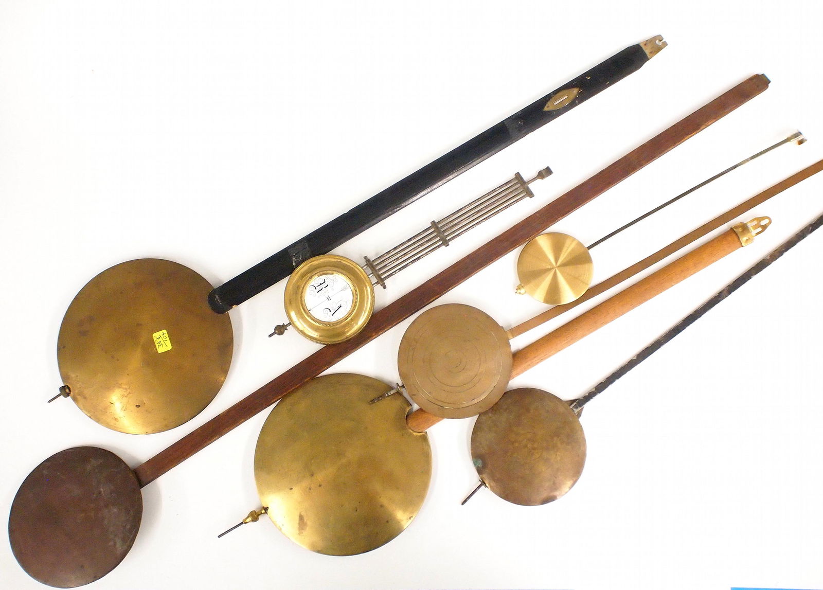 7 Vintage Clock Pendulums: Seven vintage clock pendulums. Mostly wall clocks. As/Found. ESTIMATE $20-30