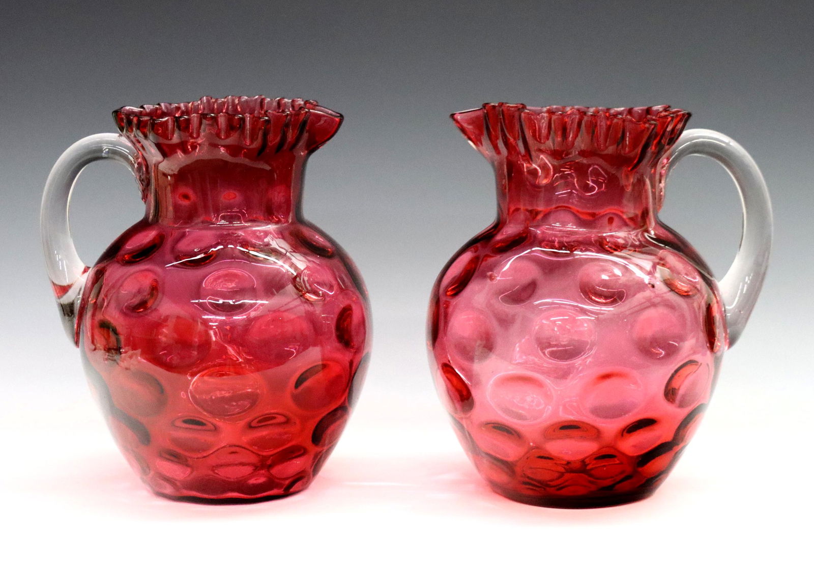 2 Cranberry Glass Pitchers (1 of 2)