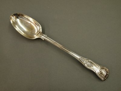 Sterling stuffing spoon: A 19th century Sterling Silver stuffing spoon by George William Adams, London, 1857. Heavy, Shell handle design. Slight wear, monogrammed. 6.80 troy ozs. 12" long. ESTIMATE $200-300