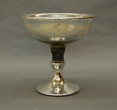 Mercury Glass compote: A 19th century Mercury Glass compote. Two part design with Pewter collar and etched "Vintage" detail on bowl. Some wear. 10 1/4" high. ESTIMATE 200-300