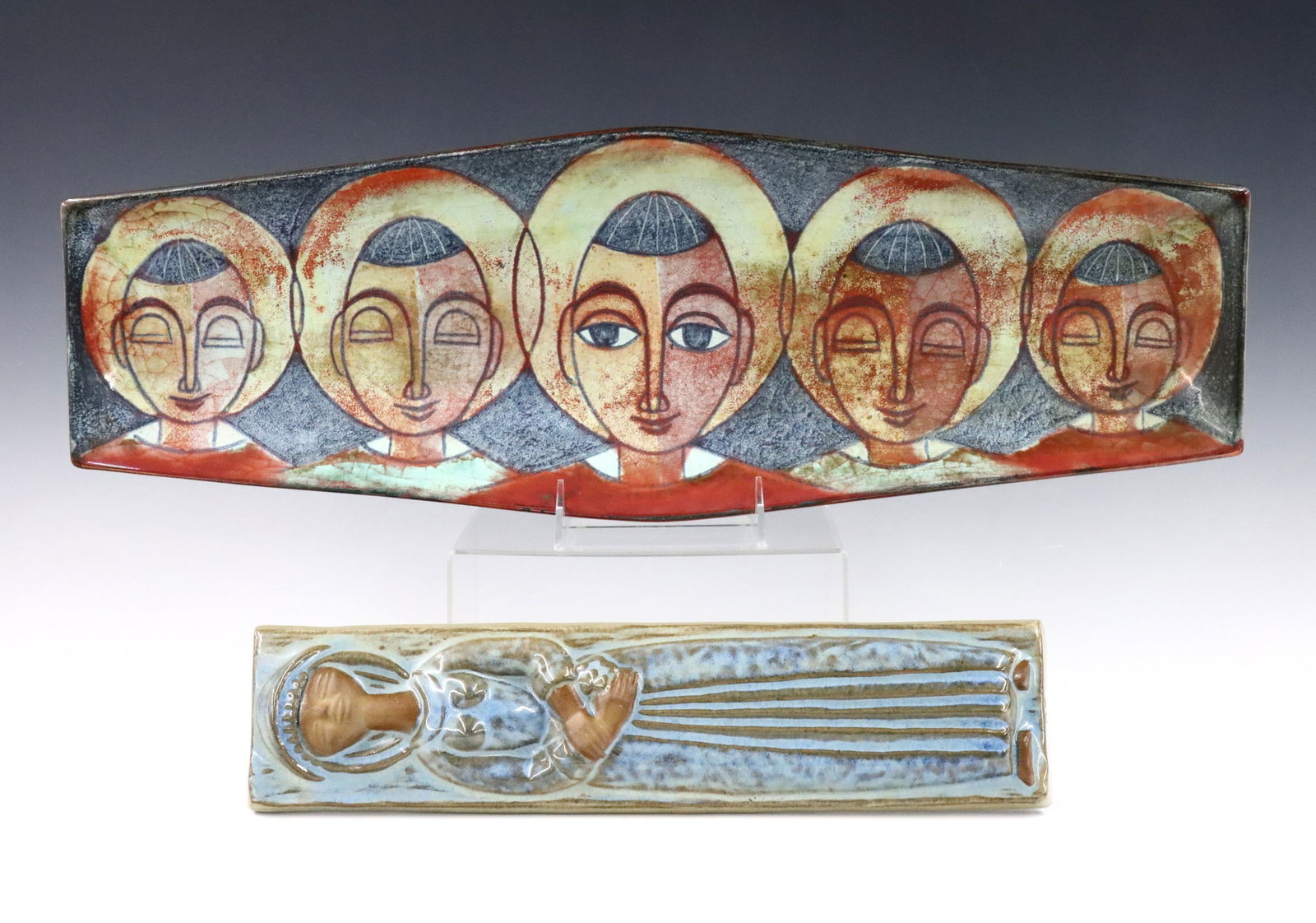 2 pc M. Anderson & Sons Pottery: Two pieces of Mid Century Danish Modern Marianne Starck for Michael Andersen & Sons Art Pottery. Includes an elongated tray with multicolor Saint motif and iridescent details, and a molded tile with f