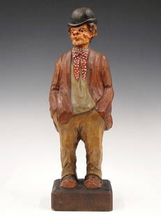 German Clockwork Whistler Figure: A mid 20th century German clockwork "Whistler" figure. Carved wooden automaton figure whose head moves and whistles a tune when activated via Brass key wind movement with bellows. Original painted fin