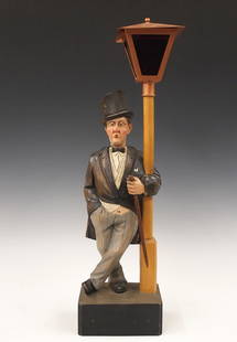 Karl Griesbaum Clockwork Whistler Figure: A mid 20th century German clockwork "Whistler" figure by Karl Griesbaum, Triberg. Carved wooden automaton figure whose head moves and whistles a tune when activated via Brass key wind movement with