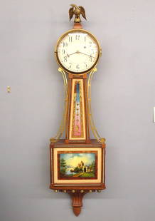 Waltham Model 904 Banjo Clock: A 20th century Waltham model 904 Banjo clock. 8-day Brass, weight driven time only movement with Geneva stops marked "Waltham Watch Co. U. S. A." with painted Iron dial and Arabic numerals marked