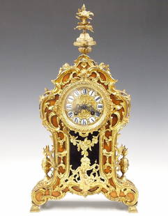 Lenzkirch Louis XV Style Table Clock: A late 19th century Lenzkirch Louis XV Style table clock. 8-day spring driven time and strike movement with embossed Brass dial and Roman numerals on porcelain markers, filigree hands and a fancy cast