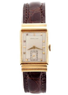 Vintage Hamilton 18k Gold Wristwatch: A vintage Hamilton 18k Gold "Gordon B" model gentleman's wristwatch. Manual wind, 19j, 754 movement with a Silvered dial, Square pyramidal/Baton markers and subsidiary seconds, serial #30043H. 22 x 36