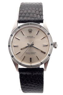 Vintage Rolex Oyster Perpetual Wristwatch: A late 1960's vintage Rolex Oyster Perpetual model gentleman's wristwatch. Automatic wind movement with a Silvered dial, Stick markers and sweep seconds, serial #1996784. 34 mm Stainless Steel case wi