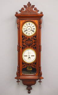 Ithaca No. 3 Vienna Calendar Wall Clock: A late 19th century Ithaca "Vienna No. 3" model Calendar wall clock. 30-day dual spring time only movement with papered metal dial and Roman numerals, lower calendar mechanism with papered dial and ro