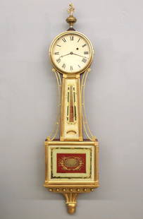 American Presentation Banjo Clock: A 19th century American Presentation Banjo clock. 8-day Brass, weight driven time only movement with painted Iron dial and Roman numerals marked "Warranted..". Gilded Mahogany case with pierced Brass