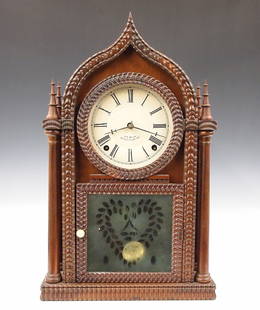 J C Brown Ripple Front Shelf Clock: A mid 19th century Ripple Front Gothic shelf clock by J. C. Brown, Forestville, Conn. 8-day Brass, spring driven time and strike movement with painted metal dial. Rosewood Onion top case with applied