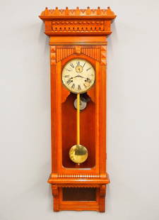 Gilbert No. 11 Regulator Wall Clock: A late 19th century Gilbert "No. 11" type Regulator wall clock. 8-day spring driven time and strike movement with a papered metal dial, Roman numerals and subsidiary seconds. Cherry Eastlake Period ca