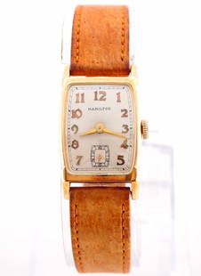 Vintage Hamilton 14k Gold Wristwatch: A vintage Hamilton 14k Gold "Donald" model gentleman's wristwatch. Manual wind, 19j, 982 movement with a Silvered dial, Arabic numerals and subsidiary seconds, serial #M117723. 21 x 29 mm 14k Yellow G