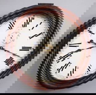 Ansonia Gallery Clock: A late 19th century Ansonia Gallery clock. 8-day time and strike movement with 18" painted metal dial and Roman numerals, subsidiary seconds. Molded Mahogany case with lift door. Some finish wear, min