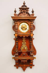 C. Werner Open Well Wall Clock: A turn of the century German open well wall clock by Carl Werner (with Konkurrenz "Horseshoe" trademark). 8-day spring driven time and strike movement with embossed Brass dial, porcelain chapter ring