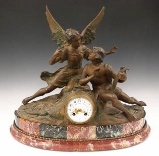 French Figural Clock: A turn of the century French mantel clock. 8-day time and strike movement with convex porcelain dial with Arabic numerals, painted swags and fancy Gilded hands, serial #11206. Rear plate with "F C" st