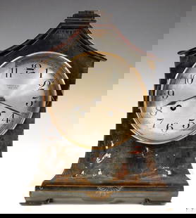 Tiffany/Chelsea Mantel Clock: An early 20th century Chelsea mantel clock made for "Tiffany & Co., New York". 8-day time and strike movement with platform escapement and convex Silvered dial with Arabic numerals. Cottage form woode
