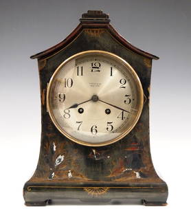 Tiffany/Chelsea Mantel Clock: An early 20th century Chelsea mantel clock made for "Tiffany & Co., New York". 8-day time and strike movement with platform escapement and convex Silvered dial with Arabic numerals. Cottage form woode