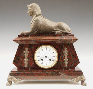 French Mantel Clock: An early 20th century Egyptian Revival Period mantel clock, by Japy Freres, retailed by "Hny Marc, Paris". 8-day time and strike movement with porcelain dial and Roman numerals. Rouge Marble case with