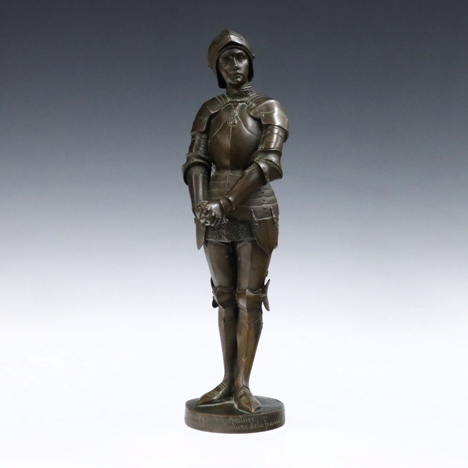 After Barrias Bronze Figure of Joan of Arc: After Louis-Ernest Barrias, French, 1841-1905. An early 20th century Bronze figure depicting Joan of Arc in armor. Inscribed "Vous avez pu m'enchainer / vous n'enchainerez jamais la Fortune de la Fran