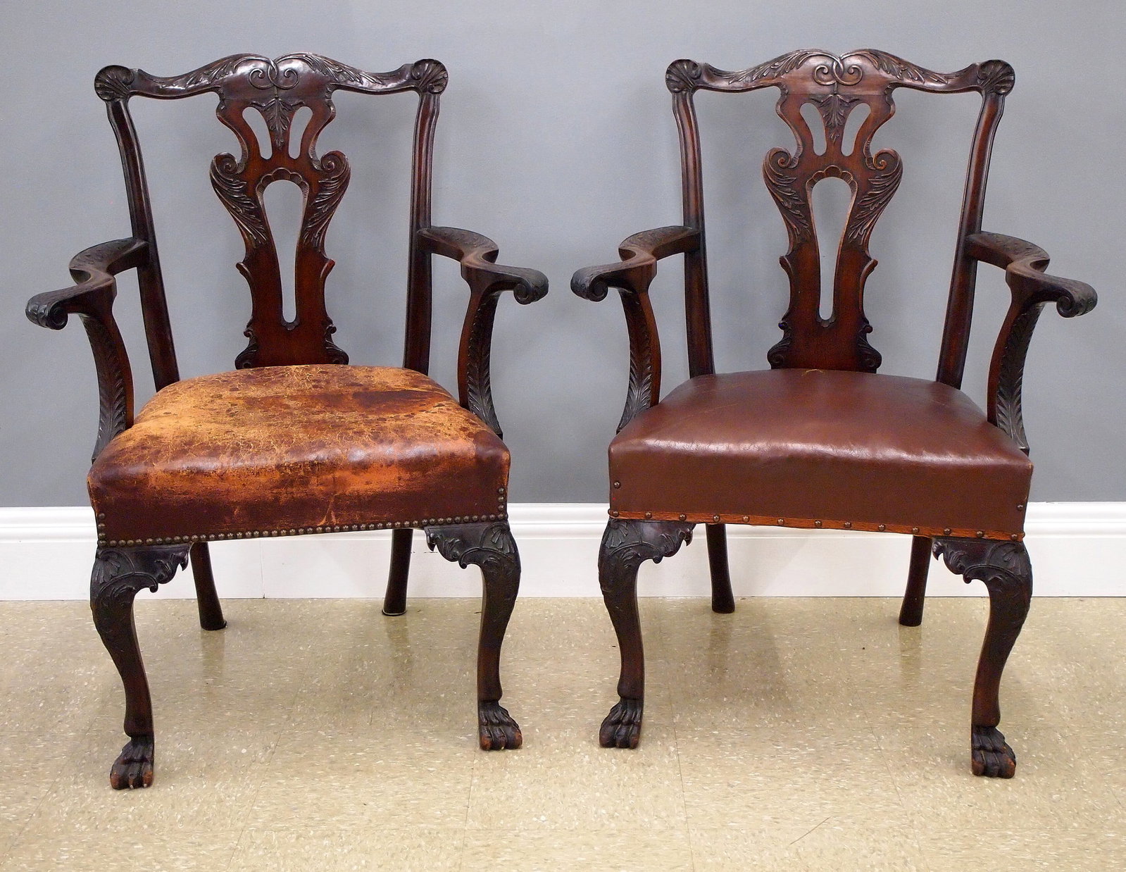 Pr Malahide Castle Armchairs: A pair of 19th century Chippendale style armchairs from Malahide Castle, Dublin, Ireland. Mahogany construction with shaped crests having acanthus and shell carved detail over pierced splats and shape