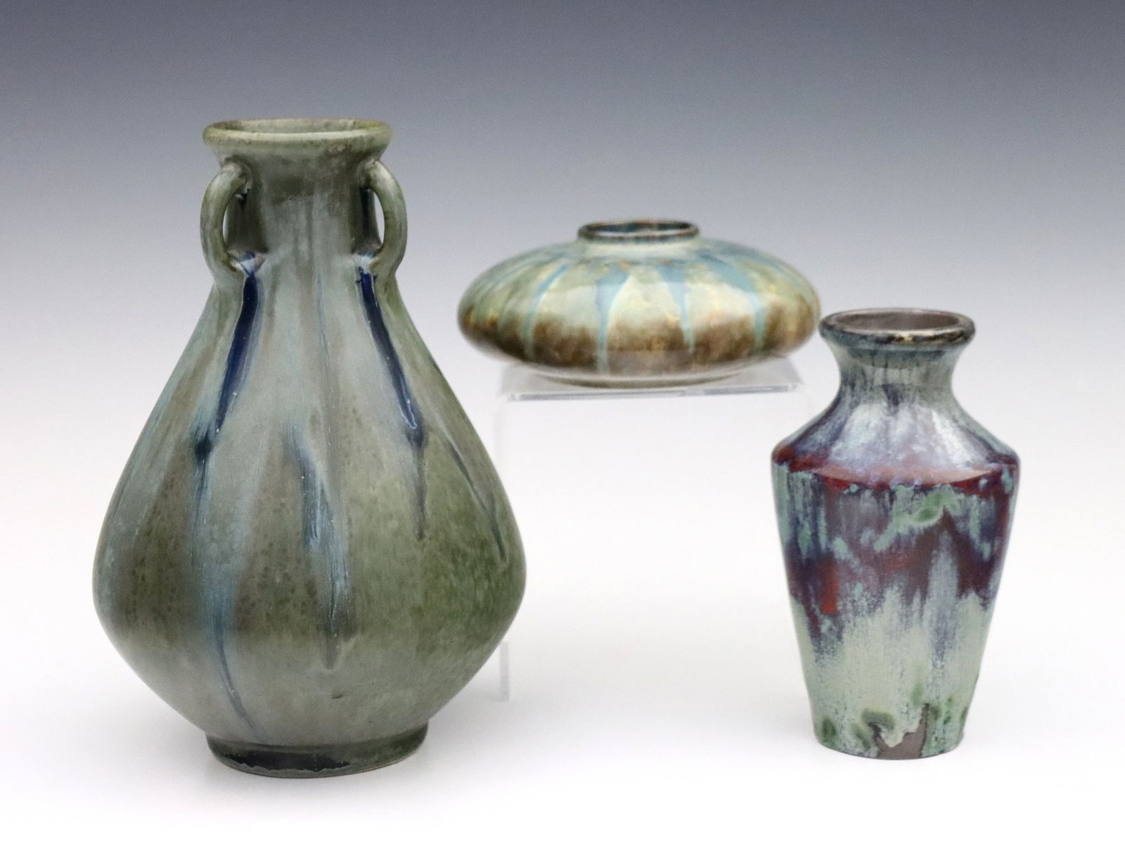 3 pc French Art Pottery Vases: Three early 20th century French Art Nouveau Pottery vases with drip glazes. Includes a Denbac bulbous vase with three handles and Green/Blue glaze, a Montigny-sur-Loing baluster vase with Turquoise/Ox