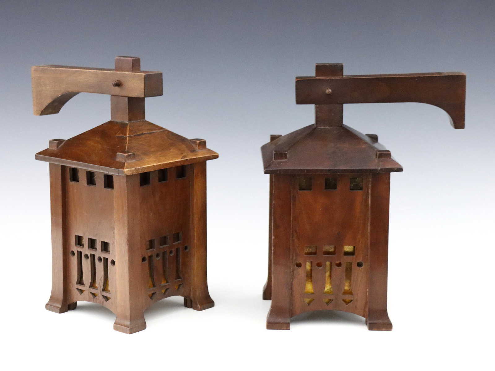 Pr Arts & Crafts Sconces: A pair of early 20th century American Arts & Crafts Period sconces. Lantern form, pierced Mahogany frames with interior Mica liners. Need to be rewired, older finish with slight wear, lacking wall bra