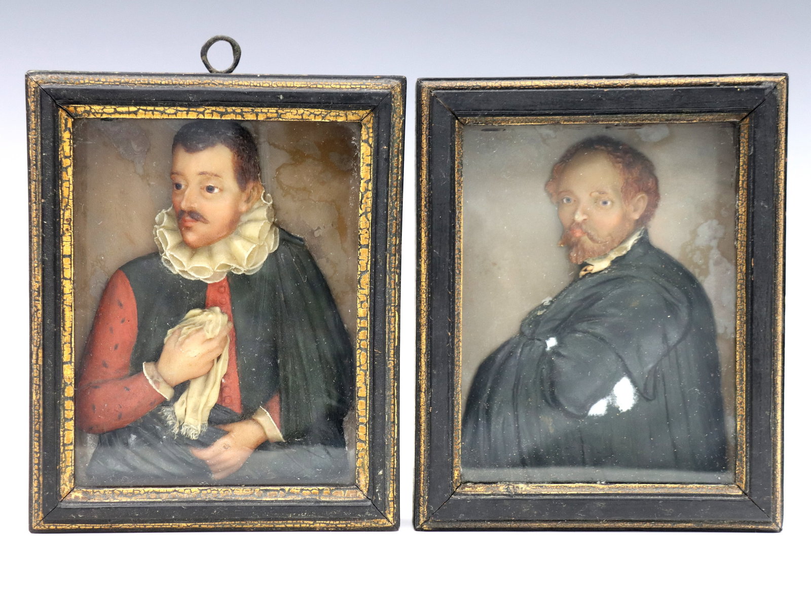 2 Italian Wax Portraits: Two 19th century Italian wax portraits depicting Peter Paul Rubens and Paolo Veronese. Carved half length busts with original polychrome painted finishes. Painted shadowbox frames with Gilded detail, 