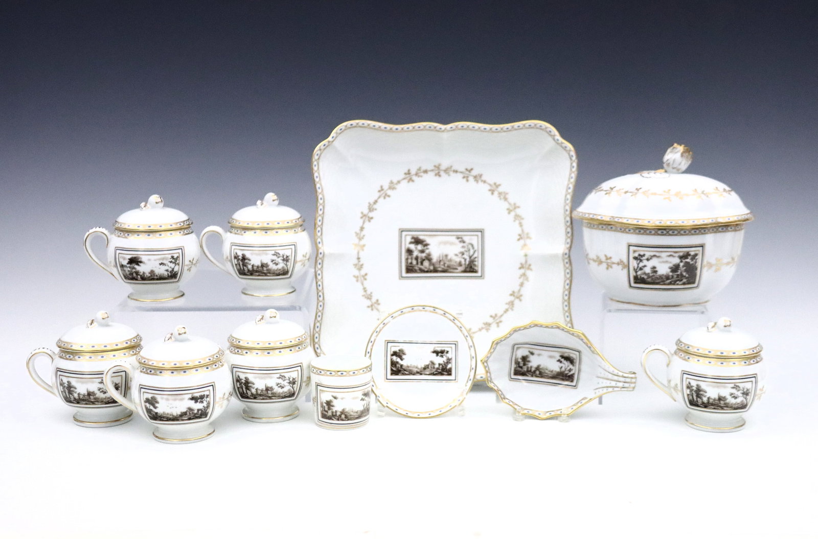 11 pc R. Ginori Pittoria Porcelain Tableware: Eleven pieces of 20th century Richard Ginori "Pittoria/Fiesole" pattern porcelain tableware. Includes six covered 'pot de cremes', a covered bowl, a square dish, a small shell form bowl and espresso c