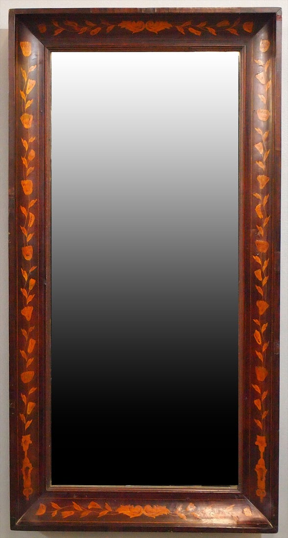 Dutch Inlaid Mirror: A 19th century Dutch inlaid wall mirror. Molded Walnut frame with contrasting Satinwood inlaid floral and foliate decoration. Some losses to mirror silvering, minor damage to veneer. 24 3/4 x 47 3/4" 
