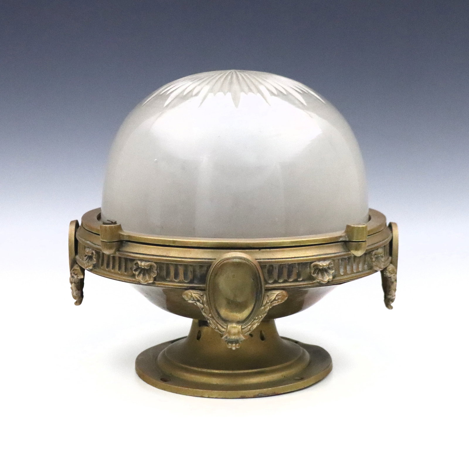 British Bronze Ceiling Light: A turn of the century British Bronze ceiling light fixture. Neoclassical design with cut starburst frosted glass shade. 10 1/2" diameter x 11" high overall. Some surface wear, needs wiring. ESTIMATE $