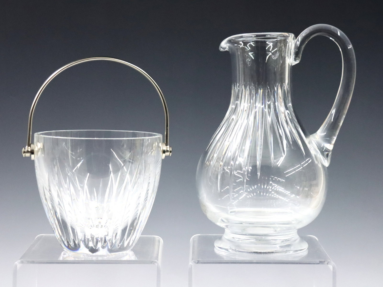 Baccarat Massena Crystal Pitcher & Ice Bucket: A late 20th century Baccarat "Massena" pattern Crystal pitcher and ice bucket. Etched "Baccarat France" marks. Minor wear. 9 1/2" and 5 1/2" high. ESTIMATE $300-500