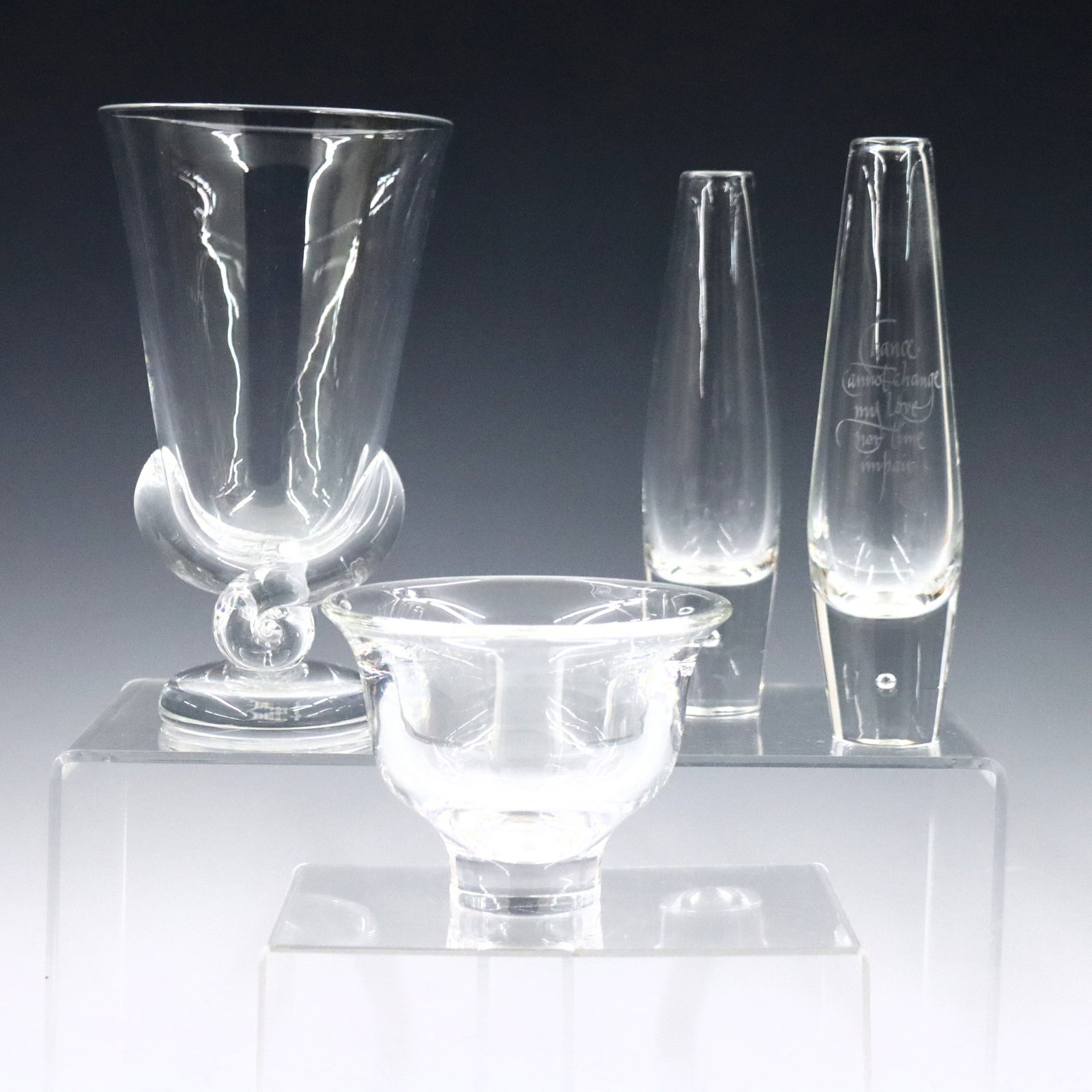 4 pc Steuben Crystal: Four pieces of mid 20th century Steuben Crystal. Includes a shape #7193 "Swirl Stem" flower vase designed by George Thompson, two shape #7989 "Teardrop" bud vases designed by David Hills, one etched "