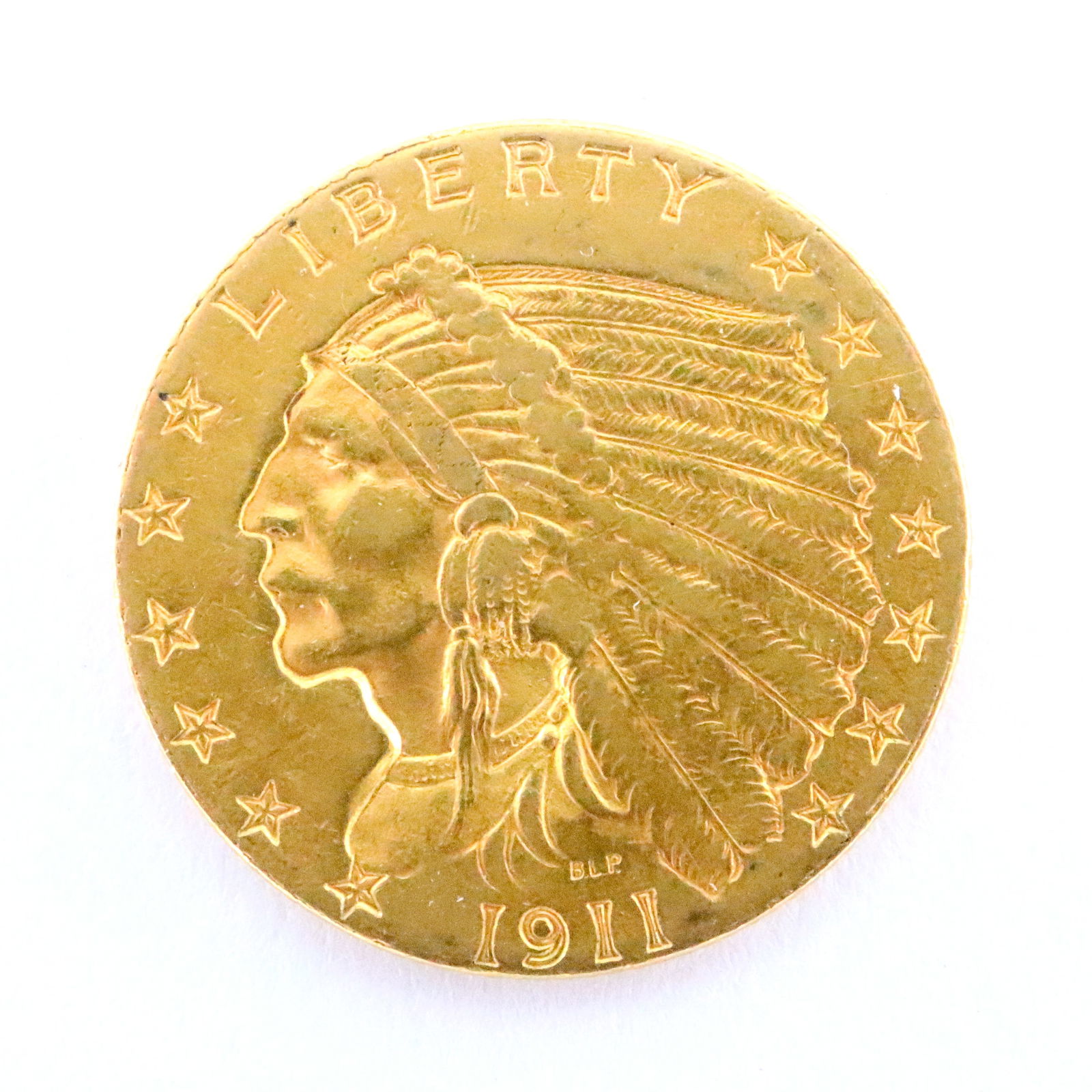 1911 U.S. Gold Indian Head Coin: A 1911 U.S. Gold "Indian Head" $2.5 Coin. Features a Native American "Chief" head on face and Eagle on the reverse. 4.2 grams total. Ungraded, minor wear. ESTIMATE $300-500