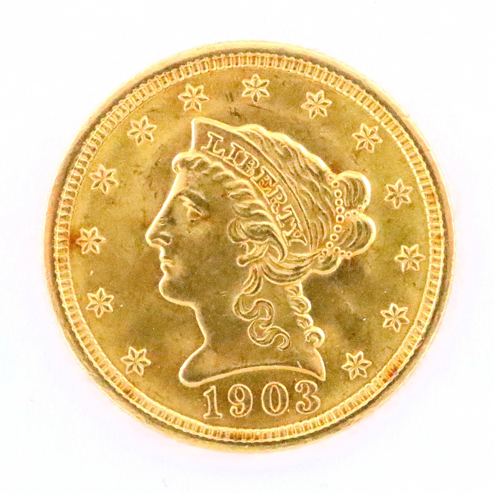 1903 U.S. Gold Liberty Head Coin: An 1903 U.S. Gold "Liberty Head" $2.5 Coin. Features "Liberty" head on face and Eagle on the reverse. 4.2 grams total. Ungraded, minor wear. ESTIMATE $200-400