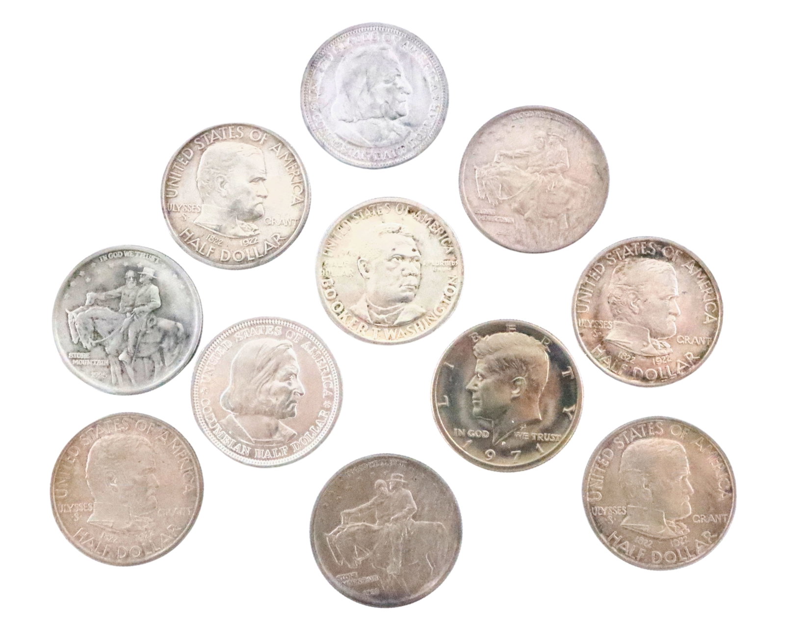 11 U.S. Silver Coins: Eleven U.S. Silver Half Dollar Coins. Includes four 1922 Grant Memorials, three 1925 Stone Mountains, two 1893 Columbian Expositions, one 1946 Booker T. Washington Commemorative, and one 1971 Kennedy.