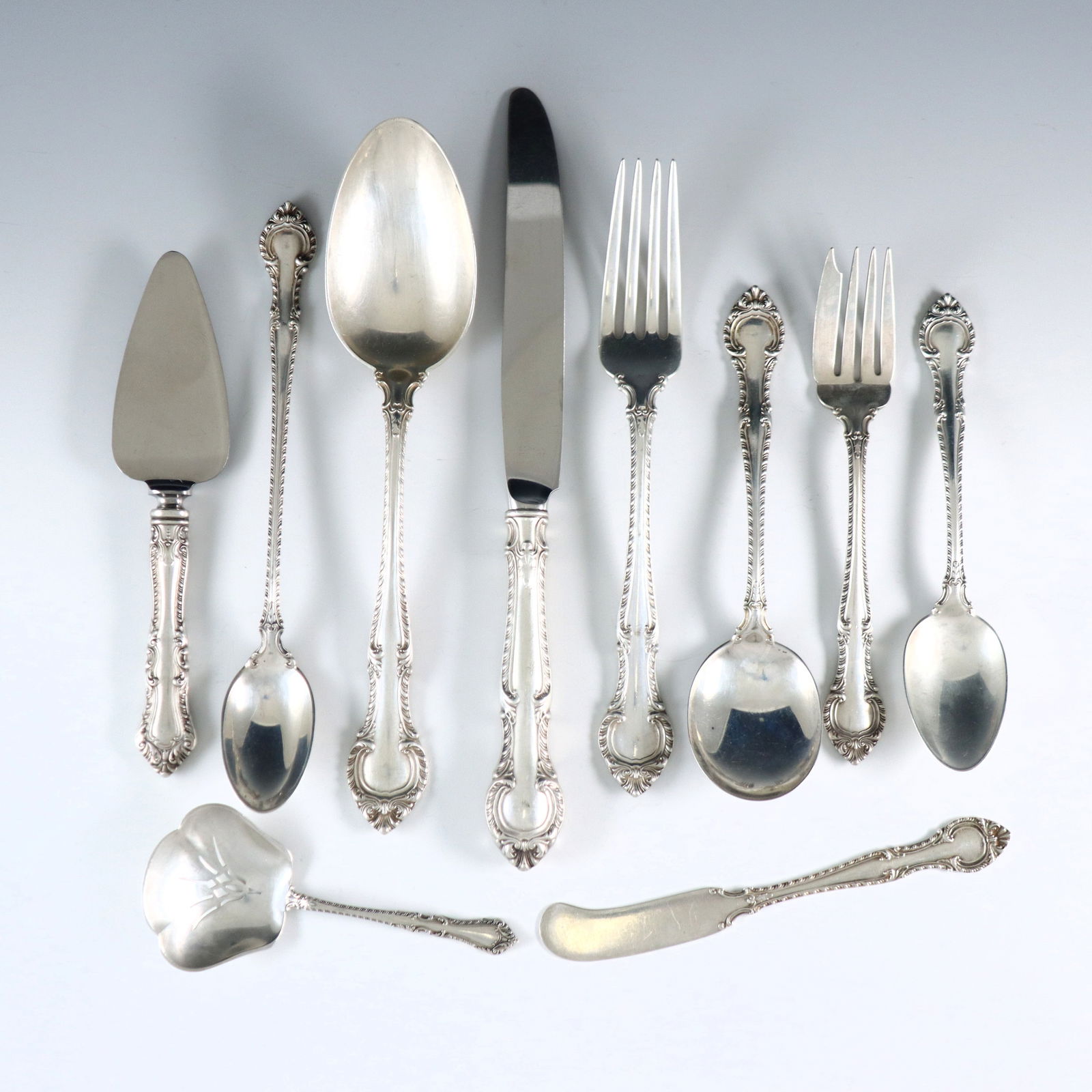 78 pc Gorham English Gadroom Sterling Flatware: Seventy-eight pieces of mid 20th century Gorham "English Gadroon" pattern Sterling Silver flatware. Features 6 complete seven-piece place settings plus additional pieces and serving utensils. Includes