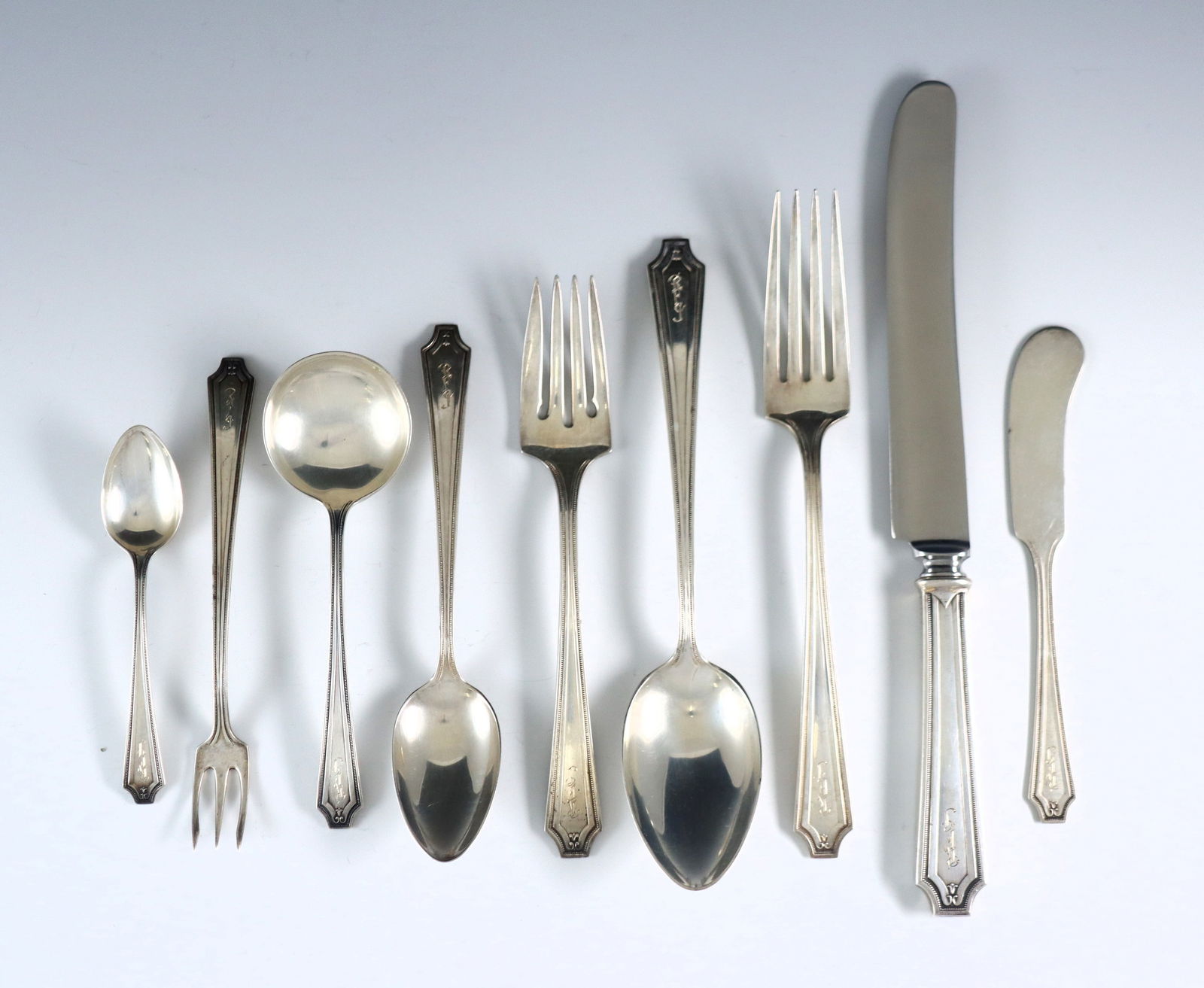 107 pc Gorham King Albert Sterling Flatware: One hundred and seven pieces of early 20th century Gorham "King Albert" pattern Sterling Silver flatware. Features 12 seven-piece place settings plus additional pieces and serving utensils. Includes 1