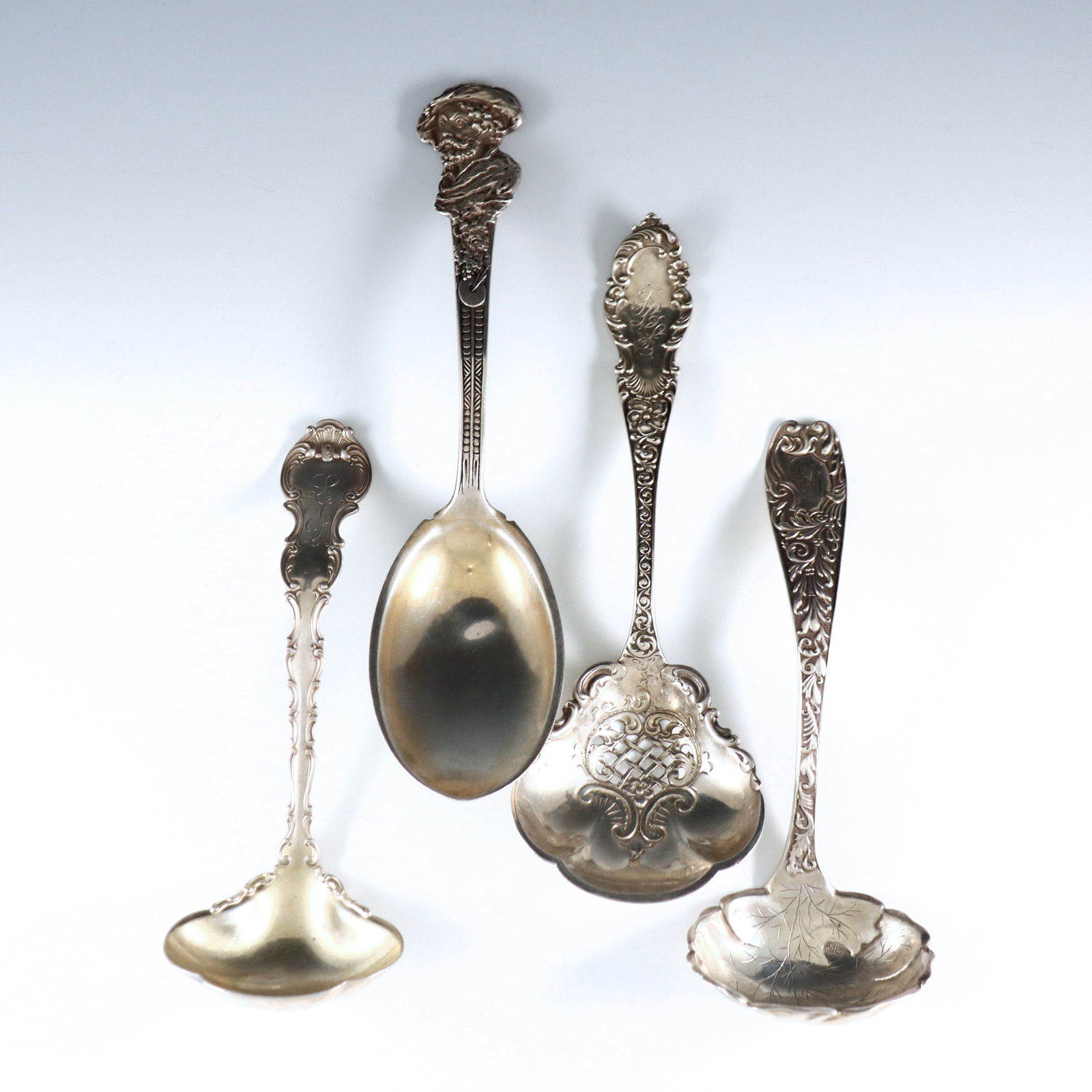 4 American Sterling Serving Utensils: Four 19th century American Sterling Silver serving utensils by various makers. Includes a Gorham "Old Masters" pattern "Reubens" berry spoon, a Hamilton & Diesinger sifter spoon and two ladles by Gorh